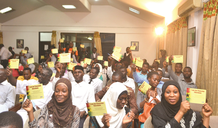 A section of the participants pledging for peaceful elections A section of the participants pledging for peaceful elections